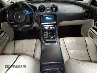 2014 Jaguar XJ Portfolio with VIN SAJWJ2GD2E8V69597, listed as a Copart auction lot 57798145 with 100,857 mi miles and Salvage title. Bid and sale history available at DreamBid. Image 8.