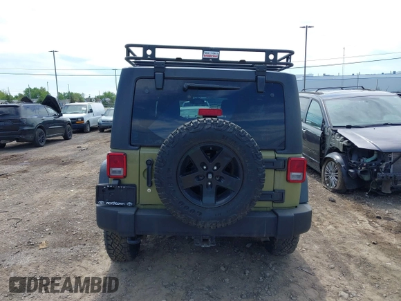 2013 Jeep Wrangler Unlimited Sport z VIN 1C4BJWDG0DL577812, wystawiony jako IAAI lot #42301104 z przebiegiem 138 387 mil mil oraz . Historia ofert i sprzedaży dostępna na DreamBid. Obrazek 16.