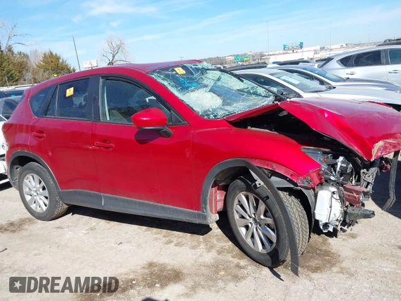 2014 Mazda CX-5 Touring z VIN JM3KE2CY2E0364488, wystawiony jako IAAI lot #41635188 z przebiegiem 127 688 mil mil oraz . Historia ofert i sprzedaży dostępna na DreamBid. Obrazek 13.