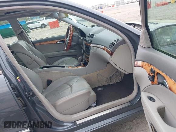 2006 Mercedes-Benz E-Class 3.5L with VIN WDBUF56J16A806413, listed as a IAAI auction lot 41936455 with 133,678 mi miles. Bid and sale history available at carsss.com. Image 5.