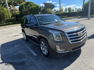 2020 Cadillac Escalade Luxury z VIN 1GYS3BKJ8LR154516, wystawiony jako Copart lot #59628455 z przebiegiem 72 098 mil mil oraz Czysty tytuł • Clean title. Historia ofert i sprzedaży dostępna na DreamBid. Obrazek 1.