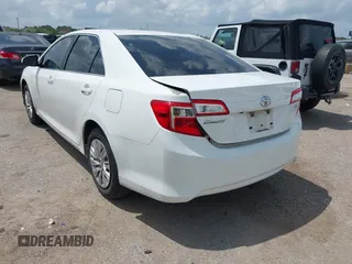 2014 Toyota Camry L with VIN 4T4BF1FK2ER375590, listed as a IAAI auction lot 42101553 with 126,849 mi miles and . Bid and sale history available at DreamBid. Image 3.