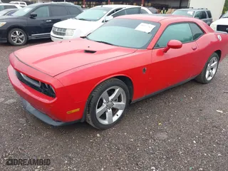2011 Dodge Challenger with VIN 2B3CJ4DG2BH557162, listed as a IAAI auction lot 41977762 with 256,629 mi miles. Bid and sale history available at carsss.com. Image 2.