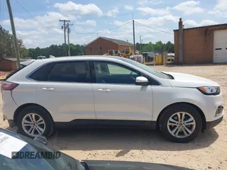 2020 Ford Edge SEL z VIN 2FMPK3J90LBA23025, wystawiony jako IAAI lot #42057424 z przebiegiem 47 119 mil mil oraz . Historia ofert i sprzedaży dostępna na DreamBid. Obrazek 13.