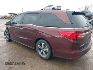 2019 Honda Odyssey Touring with VIN 5FNRL6H82KB060023, listed as a IAAI auction lot 41451199 with 82,994 mi miles. Bid and sale history available at carsss.com. Image 3.