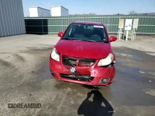 2012 Suzuki SX4 LE z VIN JS2YC5A34C6300969, wystawiony jako Copart lot #49036095 z przebiegiem 163 367 mil mil oraz Szkoda całkowita • Salvage title. Historia ofert i sprzedaży dostępna na DreamBid. Obrazek 13.
