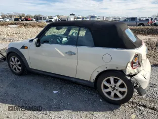 2010 MINI Convertible with VIN WMWMR3C55ATU97172, listed as a Copart auction lot 42726215 with 99,164 mi miles and Salvage Title. Bid and sale history available at DreamBid. Image 2.