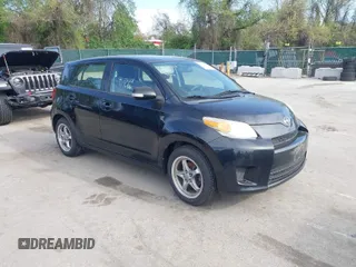 2009 Scion xD with VIN JTKKU10409J041654, listed as a IAAI auction lot 42036558 with 122,661 mi miles. Bid and sale history available at carsss.com. Image 1.