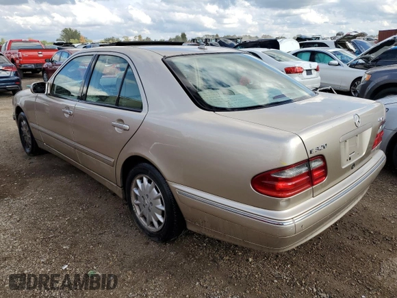 2002 Mercedes-Benz E-Class with VIN WDBJF82JX2X070380, listed as a Copart auction lot 68675974 with 88,274 mi miles and Salvage Title. Bid and sale history available at carsss.com. Image 2.