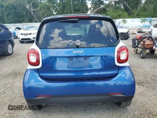 2016 Smart fortwo Passion z VIN WMEFJ5DA5GK058855, wystawiony jako Copart lot #57119445 z przebiegiem 173 493 mil mil oraz Szkody całkowita. Historia ofert i sprzedaży dostępna na DreamBid. Obrazek 6.