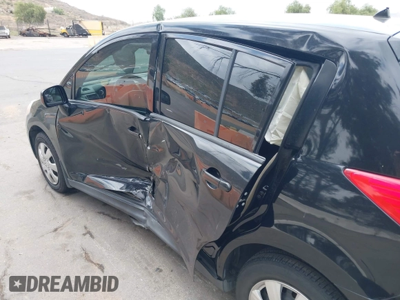 2009 Nissan Versa 1.8 S with VIN 3N1BC13E59L498728, listed as a IAAI auction lot 42110714 with 158,811 mi miles. Bid and sale history available at carsss.com. Image 6.