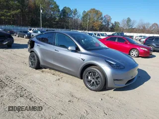2024 Tesla Model Y with VIN 7SAYGDED5RA327347, listed as a IAAI auction lot 40977005 with 1,705 mi miles and . Bid and sale history available at DreamBid. Image 1.