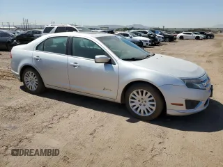 2011 Ford Fusion Hybrid с VIN 3FADP0L36BR251407, выставлен на аукционе Copart как лот 57838085 с пробегом 129 972 миль миль и Чистый • Clean title. История ставок и продаж доступна на DreamBid. Изображение 4.