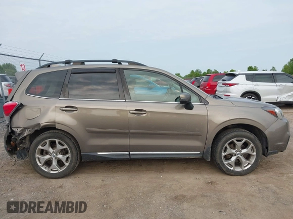 2017 Subaru Forester Touring z VIN JF2SJAWC6HH529707, wystawiony jako IAAI lot #42401138 z przebiegiem 172 868 mil mil oraz . Historia ofert i sprzedaży dostępna na DreamBid. Obrazek 13.