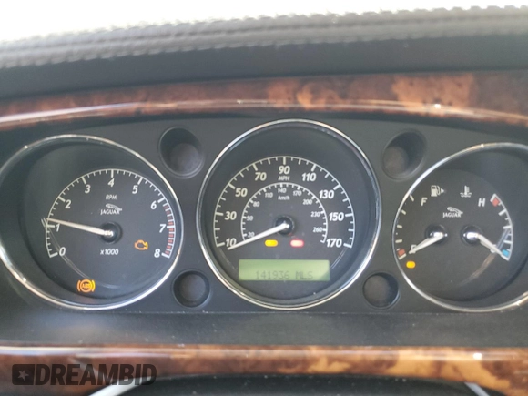 2005 Jaguar XJ Vanden Plas z VIN SAJWA82C65SG42753, wystawiony jako Copart lot #73792534 z przebiegiem 141 936 mil mil oraz Szkoda całkowita • Salvage title. Historia ofert i sprzedaży dostępna na DreamBid. Obrazek 9.