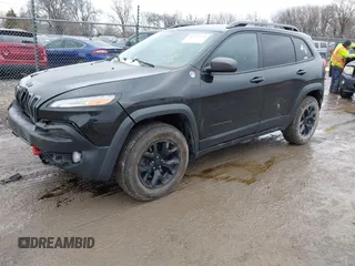 2016 Jeep Cherokee Trailhawk with VIN 1C4PJMBS6GW113069, listed as a IAAI auction lot 41757725 with 125,029 mi miles. Bid and sale history available at carsss.com. Image 2.
