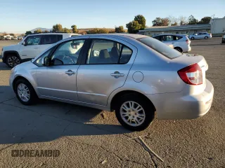2012 Suzuki SX4 LE with VIN JS2YC5A33C6301529, listed as a Copart auction lot 79363394 with 72,348 mi miles and Clean Title. Bid and sale history available at carsss.com. Image 2.