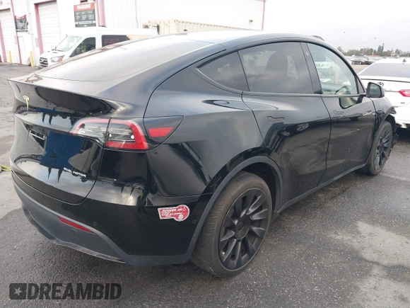 2023 Tesla Model Y Long Range with VIN 7SAYGDEE2PA024032, listed as a IAAI auction lot 41213403 with 23,418 mi miles and . Bid and sale history available at DreamBid. Image 4.