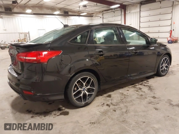 2015 Ford Focus SE with VIN 1FADP3F24FL255450, listed as a IAAI auction lot 41673301 with 103,650 mi miles. Bid and sale history available at carsss.com. Image 4.