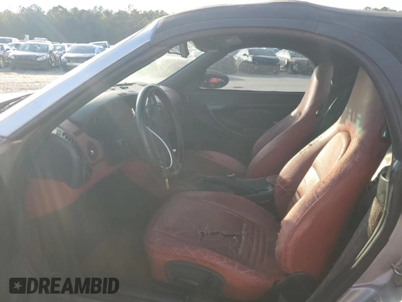 1998 Porsche Boxster с VIN WP0CA2987WS620369, выставлен на аукционе Copart как лот 81003964 с пробегом Не указан миль и Списание • Salvage title. История ставок и продаж доступна на DreamBid. Изображение 7.