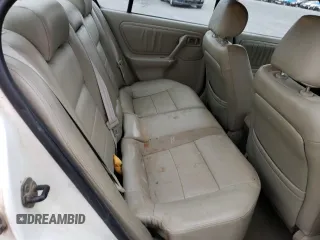 2002 Infiniti G20 Luxury z VIN JNKCP11AX2T500141, wystawiony jako Copart lot #70648434 z przebiegiem 196 559 mil mil oraz Szkody całkowita. Historia ofert i sprzedaży dostępna na DreamBid. Obrazek 11.