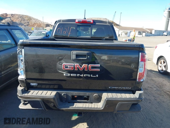 2021 GMC Canyon 4WD Denali z VIN 1GTG6EEN9M1240596, wystawiony jako IAAI lot #40760124 z przebiegiem 52 985 mil mil oraz . Historia ofert i sprzedaży dostępna na DreamBid. Obrazek 16.