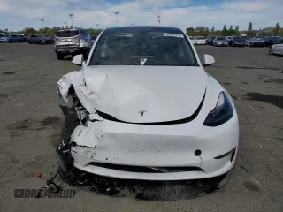 2022 Tesla Model Y Performance с VIN 7SAYGDEF2NF405596, выставлен на аукционе Copart как лот 52868195 с пробегом Не указан миль и Списание • Salvage title. История ставок и продаж доступна на DreamBid. Изображение 5.