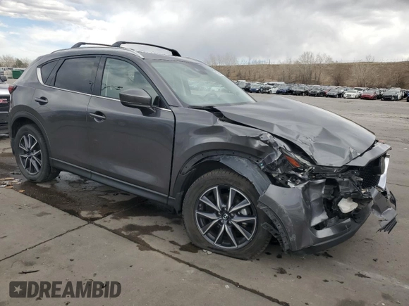 2017 Mazda CX-5 Grand Touring with VIN JM3KFBDL4H0163339, listed as a Copart auction lot 50566495 with 83,453 mi miles and Salvage Title. Bid and sale history available at carsss.com. Image 4.