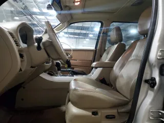 2007 Mercury Mariner Premier with VIN 4M2CU97127KJ20010, listed as a Copart auction lot 52123205 with 162,337 mi miles and Salvage title. Bid and sale history available at DreamBid. Image 7.