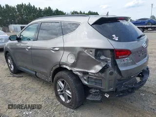 2018 Hyundai Santa Fe 2.4L z VIN 5NMZUDLB4JH073857, wystawiony jako IAAI lot #42200208 z przebiegiem 127 038 mil mil oraz . Historia ofert i sprzedaży dostępna na DreamBid. Obrazek 3.