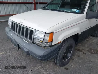 1997 Jeep Grand Cherokee Laredo z VIN 1J4GZ58S7VC737980, wystawiony jako IAAI lot #42256142 z przebiegiem 188 958 mil mil oraz . Historia ofert i sprzedaży dostępna na DreamBid. Obrazek 6.