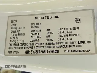 2020 Tesla Model 3 Standard Range Plus with VIN 5YJ3E1EA6LF799620, listed as a IAAI auction lot 42221643 with 55,458 mi miles and . Bid and sale history available at carsss.com. Image 9.