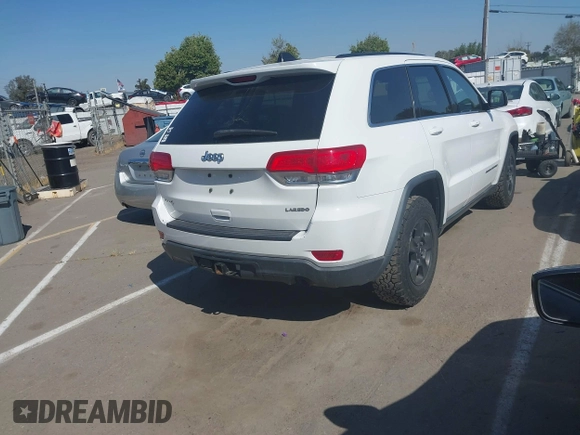 2014 Jeep Grand Cherokee Laredo with VIN 1C4RJFAG9EC334021, listed as a IAAI auction lot 42128823 with 161,741 mi miles. Bid and sale history available at carsss.com. Image 4.