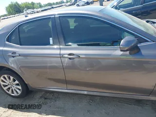 2019 Toyota Camry LE z VIN 4T1B11HK4KU797720, wystawiony jako IAAI lot #42053830 z przebiegiem 102 558 mil mil oraz . Historia ofert i sprzedaży dostępna na DreamBid. Obrazek 13.