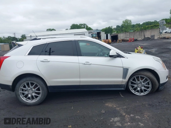 2013 Cadillac SRX Performance Collection with VIN 3GYFNHE34DS628486, listed as a IAAI auction lot 42530124 with 76,778 mi miles and . Bid and sale history available at DreamBid. Image 13.