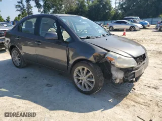 2011 Suzuki SX4 LE with VIN JS2YC5A27B6304410, listed as a Copart auction lot 72119824 with 118,357 mi miles and Salvage Title. Bid and sale history available at carsss.com. Image 4.