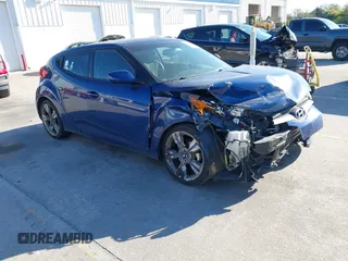 2016 Hyundai Veloster with VIN KMHTC6AD8GU302014, listed as a IAAI auction lot 41764406 with 102,893 mi miles. Bid and sale history available at carsss.com. Image 1.