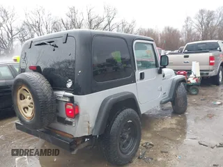 2006 Jeep Wrangler Sport Right Hand Drive with VIN 1J4F449SX6P764491, listed as a IAAI auction lot 41709726 with 290,798 mi miles. Bid and sale history available at carsss.com. Image 4.