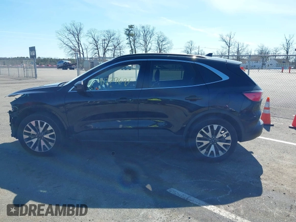 2020 Ford Escape Titanium z VIN 1FMCU9J98LUA44923, wystawiony jako IAAI lot #41779691 z przebiegiem 73 259 mil mil oraz . Historia ofert i sprzedaży dostępna na DreamBid. Obrazek 14.