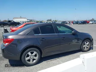 2014 Chevrolet Cruze 1LT z VIN 1G1PC5SB5E7154437, wystawiony jako IAAI lot #42215520 z przebiegiem 152 834 mil mil oraz . Historia ofert i sprzedaży dostępna na DreamBid. Obrazek 14.