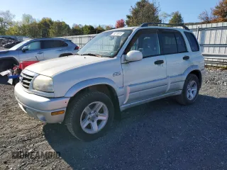2003 Suzuki Grand Vitara z VIN JS3TD62V234103268, wystawiony jako Copart lot #76276914 z przebiegiem 133 227 mil mil oraz Tytuł czysty. Historia ofert i sprzedaży dostępna na DreamBid. Obrazek 1.