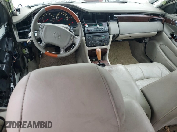 2000 Cadillac DeVille DTS z VIN 1G6KF5797YU263599, wystawiony jako Copart lot #81576484 z przebiegiem 118 414 mil mil oraz Szkoda całkowita • Salvage title. Historia ofert i sprzedaży dostępna na DreamBid. Obrazek 8.