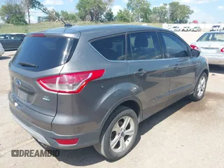 2014 Ford Escape SE with VIN 1FMCU9GX0EUE12195, listed as a IAAI auction lot 42674879 with 96,576 mi miles and . Bid and sale history available at DreamBid. Image 4.