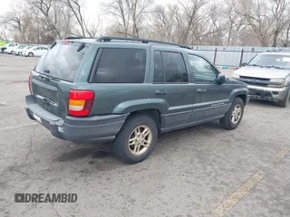2003 Jeep Grand Cherokee Laredo with VIN 1J4GX48S03C536709, listed as a IAAI auction lot 41908946 with 240,435 mi miles. Bid and sale history available at carsss.com. Image 4.
