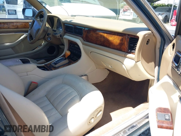 1996 Jaguar XJ with VIN SAJHX1740TC766425, listed as a IAAI auction lot 42758458 with 257,849 mi miles and . Bid and sale history available at DreamBid. Image 5.