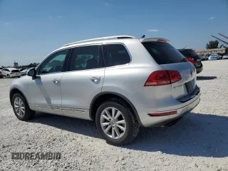 2014 Volkswagen Touareg Sport with VIN WVGEF9BP8ED005445, listed as a Copart auction lot 53694215 with 194,711 mi miles and Salvage Title. Bid and sale history available at DreamBid. Image 2.