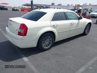 2009 Chrysler 300 Touring with VIN 2C3KA53V39H632191, listed as a IAAI auction lot 41936327 with 148,646 mi miles. Bid and sale history available at carsss.com. Image 4.