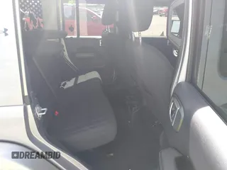 2018 Jeep Wrangler Unlimited Sahara with VIN 1C4HJXEG4JW115522, listed as a IAAI auction lot 42322791 with 68,409 mi miles and . Bid and sale history available at DreamBid. Image 8.