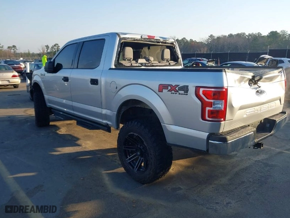 2018 Ford F-150 XL with VIN 1FTEW1E57JFC31779, listed as a IAAI auction lot 41784467 with 142,676 mi miles. Bid and sale history available at carsss.com. Image 3.