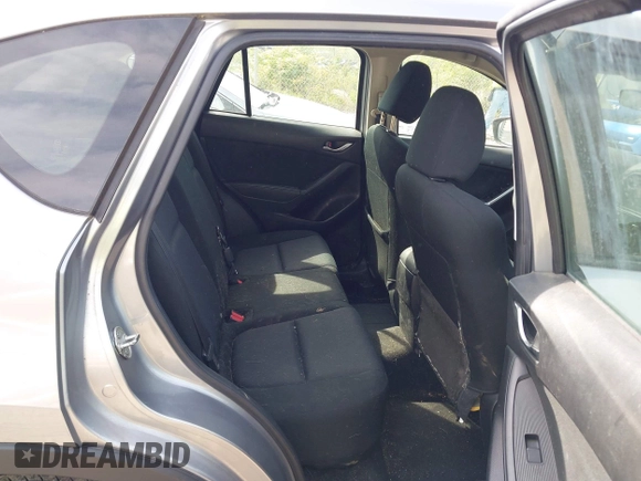 2014 Mazda CX-5 Sport with VIN JM3KE2BE9E0423737, listed as a IAAI auction lot 42222646 with 116,160 mi miles and . Bid and sale history available at DreamBid. Image 8.